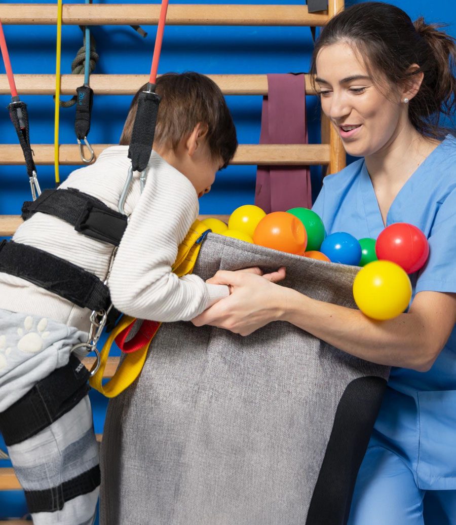 A child building fine motor skills in a therapy gym